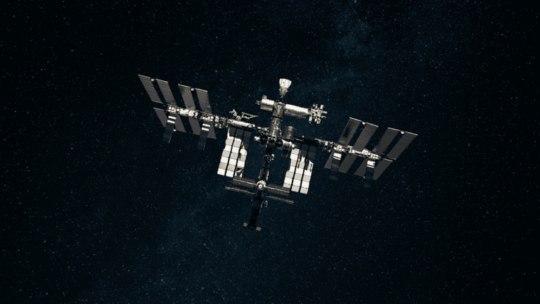 The International Space Station orbiting Earth against a backdrop of stars